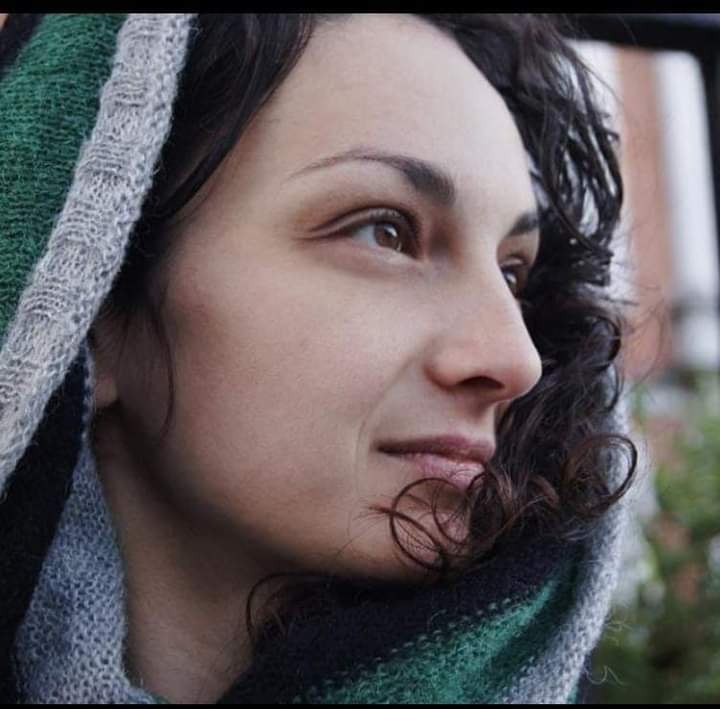 Portrait of Snejana Angelova wearing a green hood